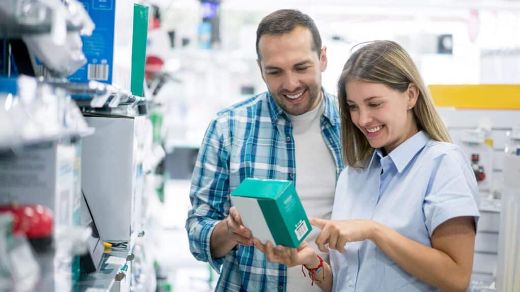 Two college students shop for electronics.