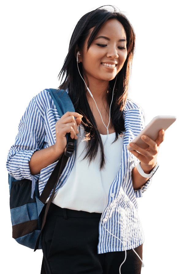 Female student smiling while looking at cell phone