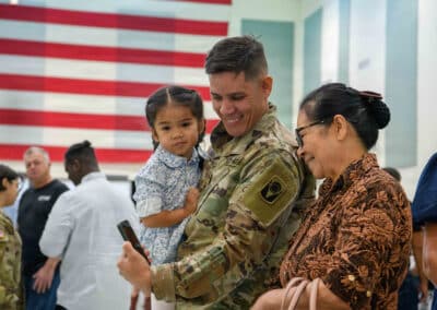 Military family looking at phone