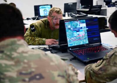 Military personnel working in computer lab